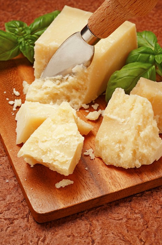 Parmesan cheese is usually served grated or "a scaglie", shavings