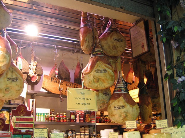 Whole Prosciutti on sale in a shop in FlorencePh. flickr/Aya Otake