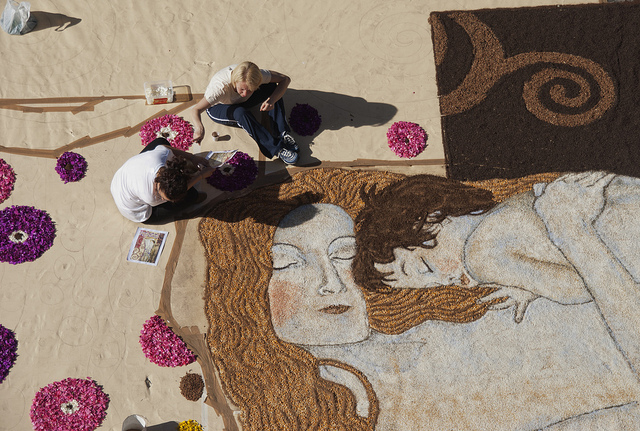 Artists at work for the Infiorata di Genzano, a traditional Italian event 