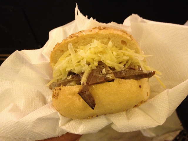 Strange Italian food made in Palermo: a pani ca meusa maritatu: you can see the caciocavallo, but notthe ricotta, because one  half of the bread bun is usually emptied and filled with it