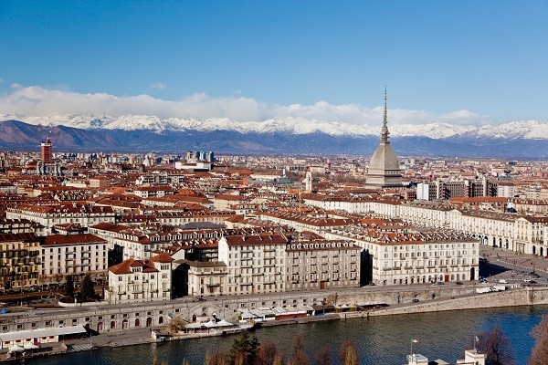 Turin, the Mole Antonelliana and snowy Alps in the background. 