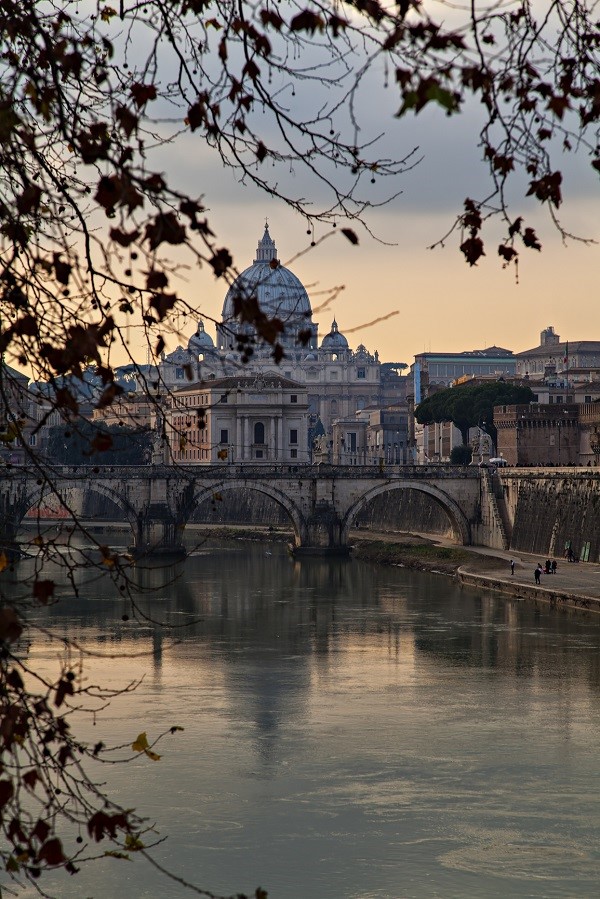 Italy viewed from a river: the Tiber and Rome in the evening