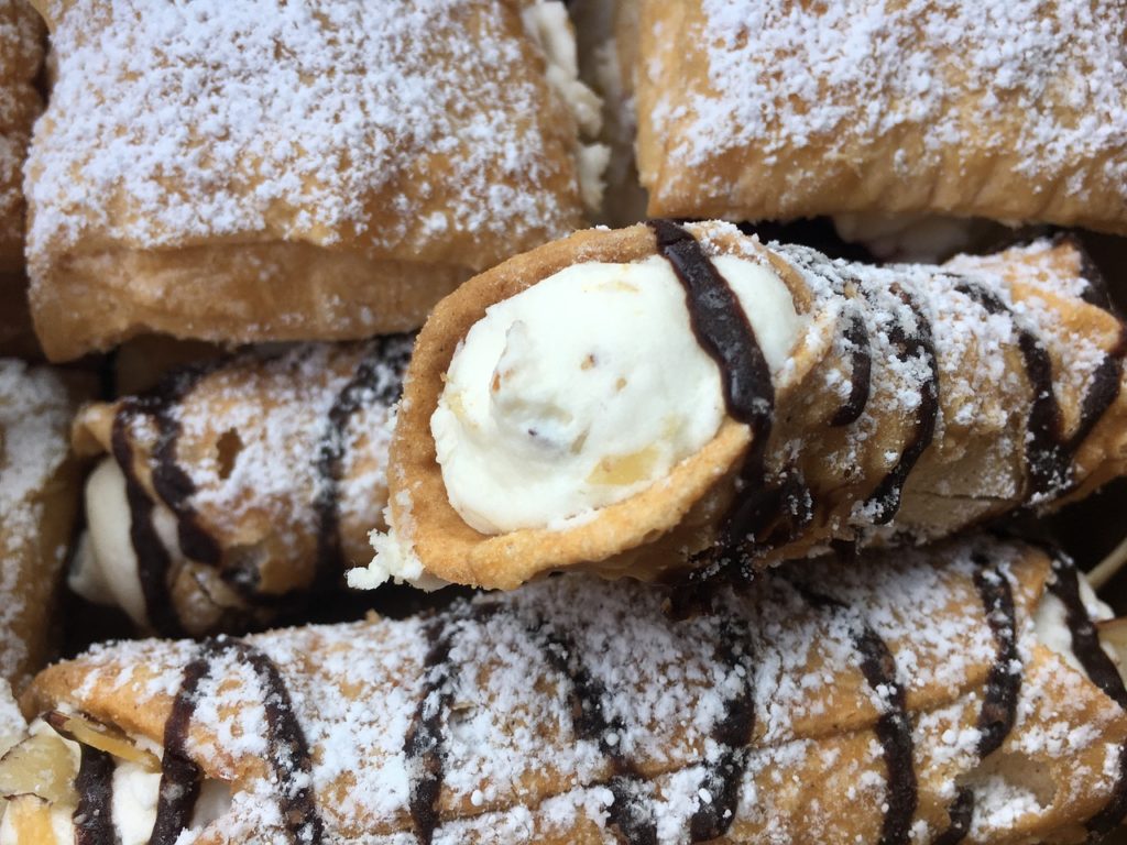Cannoli Siciliani with candied fruit and chocolate drizzle